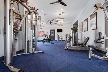 24-Hour fitness center with cardio and weight training equipment